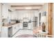 Bright kitchen with stainless steel appliances, white cabinets, and hardwood counters at 108 N Hazard St., Georgetown, SC 29440