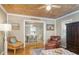 Cozy living room with hardwood floors, neutral walls, and access to dining area at 108 N Hazard St., Georgetown, SC 29440