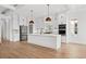 Modern kitchen with white cabinets, island, and stainless steel appliances at 1219 Bent Creek Ln., Myrtle Beach, SC 29579