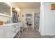 Bathroom with double vanity, large mirror, and grey wood-look floor at 1772 Bay Tree Ln., Surfside Beach, SC 29575