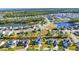 Expansive aerial view of a Primary-planned community featuring ponds, mature trees, and well-maintained homes at 217 Astoria Park Loop, Conway, SC 29526