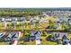 Aerial view showcasing the property, its well-manicured lawn, water view, and neighborhood at 217 Astoria Park Loop, Conway, SC 29526