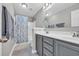 Clean bathroom with gray vanity, shower, and coordinated towel set at 217 Astoria Park Loop, Conway, SC 29526