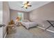 Simple bedroom with a comfortable bed, natural light, and space for storage at 217 Astoria Park Loop, Conway, SC 29526