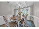 Dining room with modern chandelier, arched doorway and large windows at 217 Astoria Park Loop, Conway, SC 29526