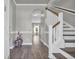 Elegant foyer featuring hardwood floors, staircase, and arched doorway at 217 Astoria Park Loop, Conway, SC 29526