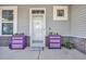Charming front porch with decorative flower boxes and welcome mat at 217 Astoria Park Loop, Conway, SC 29526