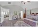 A relaxing main bedroom with a four poster bed, vaulted ceilings and a vanity area with natural light at 217 Astoria Park Loop, Conway, SC 29526