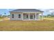 Backyard view of the back of the house showing the porch and part of the yard at 240 Palmetto Sand Loop, Conway, SC 29527