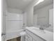 A bathroom featuring a tiled shower-tub, toilet, and vanity with a white countertop and mirror at 240 Palmetto Sand Loop, Conway, SC 29527