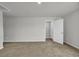 An empty bedroom with neutral walls, carpet, and an open doorway at 240 Palmetto Sand Loop, Conway, SC 29527