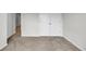 Bedroom featuring carpet, white walls, base trim, and double doors at 240 Palmetto Sand Loop, Conway, SC 29527
