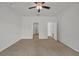 Unfurnished bedroom with neutral carpet, ceiling fan, and ample natural light from the window at 240 Palmetto Sand Loop, Conway, SC 29527
