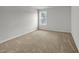 A bedroom with neutral walls, carpet, and a single window at 240 Palmetto Sand Loop, Conway, SC 29527