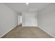 A bedroom with neutral walls, carpet, a double door closet, and an open doorway at 240 Palmetto Sand Loop, Conway, SC 29527