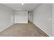 A bedroom with neutral walls, carpet, a ceiling access door, and an open doorway at 240 Palmetto Sand Loop, Conway, SC 29527