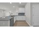 Bright kitchen featuring granite countertops, stainless steel appliances, and ample cabinet space at 240 Palmetto Sand Loop, Conway, SC 29527