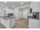 Modern kitchen with white cabinets, stainless steel appliances, and granite countertops at 240 Palmetto Sand Loop, Conway, SC 29527