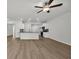 Open-concept living area features hardwood flooring and is connected to the kitchen at 240 Palmetto Sand Loop, Conway, SC 29527