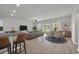 Open-concept living space with modern decor, granite countertops, and large windows at 240 Palmetto Sand Loop, Conway, SC 29527