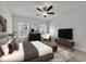 Comfortable main bedroom with stylish decor, neutral carpet, and natural lighting at 240 Palmetto Sand Loop, Conway, SC 29527
