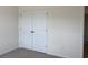 Bedroom featuring neutral carpet, closet with bi-fold doors, and light neutral walls at 300 Palmetto Sand Loop, Conway, SC 29527