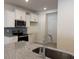 Kitchen with stainless steel appliances, granite countertops, and a view of the door leading outside at 300 Palmetto Sand Loop, Conway, SC 29527