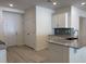 Modern kitchen featuring white cabinets, granite countertops, and stainless steel appliances at 300 Palmetto Sand Loop, Conway, SC 29527