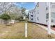 Relaxing backyard space with picnic table, grill, and grassy area offers a perfect spot for outdoor gatherings at 351 Lake Arrowhead Rd. # 24-195, Myrtle Beach, SC 29572