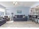 Comfortable living room with neutral colors, ceiling fan, and view into the kitchen at 351 Lake Arrowhead Rd. # 24-195, Myrtle Beach, SC 29572