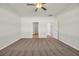 Cozy bedroom with neutral carpet, ceiling fan, and two doorways leading to other parts of the home at 432 Hallie Martin Rd., Conway, SC 29527