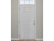 Interior view showing a white six-panel front door and wood flooring at 432 Hallie Martin Rd., Conway, SC 29527