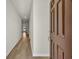 Hallway view of new home featuring neutral paint and wood flooring at 432 Hallie Martin Rd., Conway, SC 29527