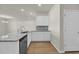 Charming kitchen with granite counters, a stainless steel dishwasher and white cabinets for ample storage at 432 Hallie Martin Rd., Conway, SC 29527