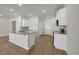 Modern kitchen with white cabinets, granite countertops, a tile backsplash, and stainless steel appliances at 432 Hallie Martin Rd., Conway, SC 29527