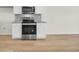Contemporary kitchen featuring stainless steel oven and microwave appliances against white cabinets and granite counters at 432 Hallie Martin Rd., Conway, SC 29527