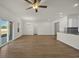 Spacious open-concept living room featuring wood flooring and sliding glass doors leading to the backyard at 432 Hallie Martin Rd., Conway, SC 29527