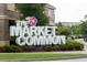 The Market Common sign is surrounded by landscaping and greenery, located in a commercial area at 432 Hallie Martin Rd., Conway, SC 29527