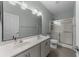 Bathroom with double sink vanity, a large mirror, and a glass-enclosed shower at 4818 Innisbrook Ct. # 603, Myrtle Beach, SC 29579