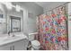 Bathroom with floral shower curtain, and a light green wall at 4818 Innisbrook Ct. # 603, Myrtle Beach, SC 29579