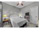 Bedroom features a ceiling fan, side tables with lamps, and neutral carpet at 4818 Innisbrook Ct. # 603, Myrtle Beach, SC 29579