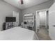 Bedroom features a TV, a desk with drawers, and neutral carpet at 4818 Innisbrook Ct. # 603, Myrtle Beach, SC 29579