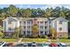 Multi-Gathering building featuring three stories, traditional architectural details, and multiple balconies at 4818 Innisbrook Ct. # 603, Myrtle Beach, SC 29579