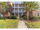 Beautiful condo complex featuring white pillars, brick accents, and lush landscaping in a desirable neighborhood at 4818 Innisbrook Ct. # 603, Myrtle Beach, SC 29579