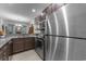 Kitchen with stainless appliances, granite countertops and modern cabinets, and a view of dining area at 4818 Innisbrook Ct. # 603, Myrtle Beach, SC 29579
