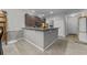 Open kitchen featuring a breakfast bar, stainless steel appliances, and seamless flow to the dining area at 4818 Innisbrook Ct. # 603, Myrtle Beach, SC 29579