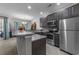 Modern kitchen featuring stainless steel appliances, granite countertops, and a breakfast bar at 4818 Innisbrook Ct. # 603, Myrtle Beach, SC 29579