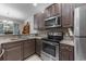 A well-equipped kitchen with stainless steel appliances, granite countertops, and modern cabinetry at 4818 Innisbrook Ct. # 603, Myrtle Beach, SC 29579
