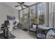 Bright sunroom features large windows, ceiling fan, and neutral tile flooring at 4818 Innisbrook Ct. # 603, Myrtle Beach, SC 29579