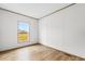 Bright bedroom with wood-look floors and a large window at 5988 Pleasant View Church Rd., Nichols, SC 29581